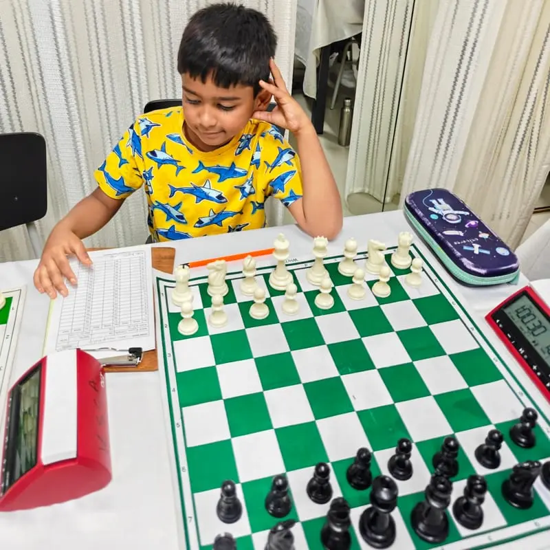 Riyaan at the board during a game