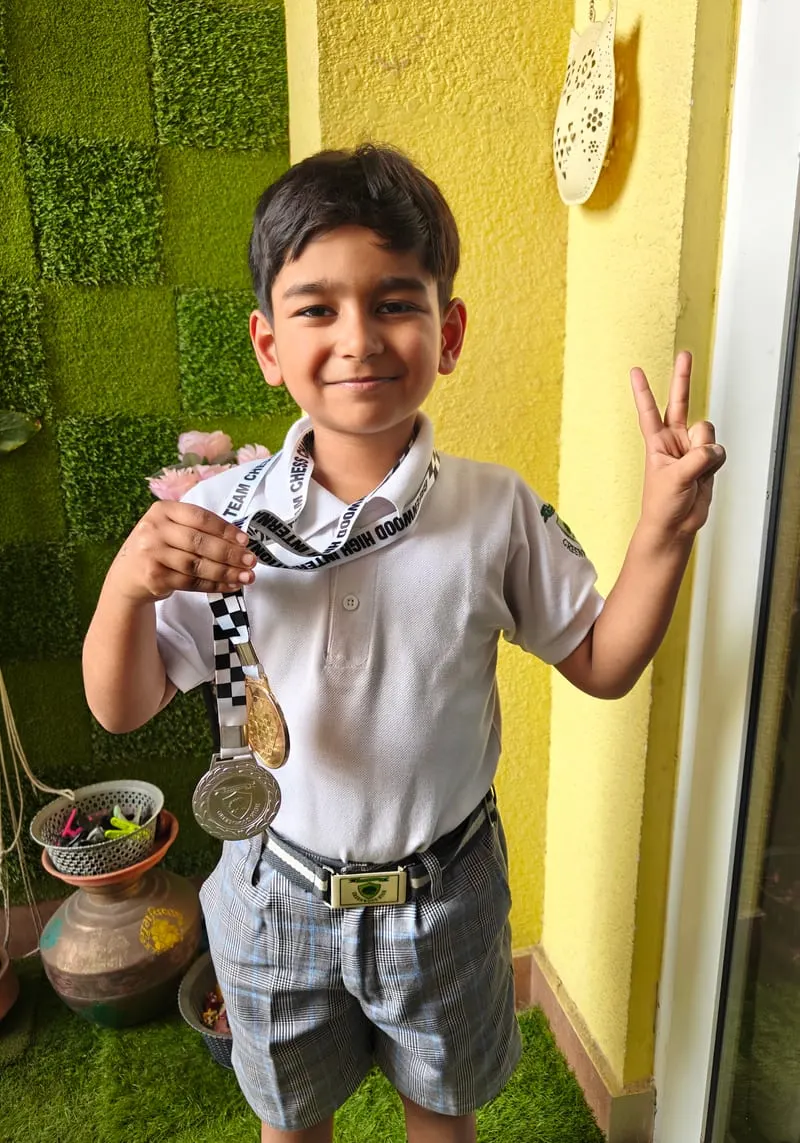 Riyaan Sidharth wearing his gold and silver team medals from the Karnataka State Schools Team Championship