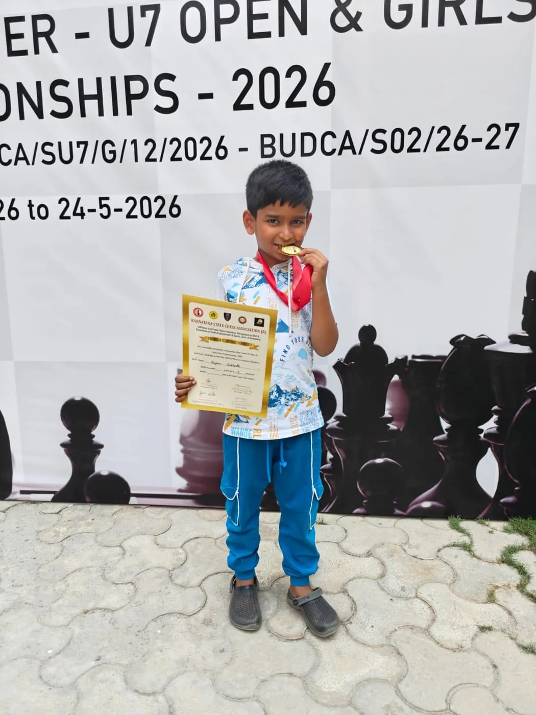 Riyaan Sidharth receiving his winner's award on stage at the Karnataka State Under-7 Championship