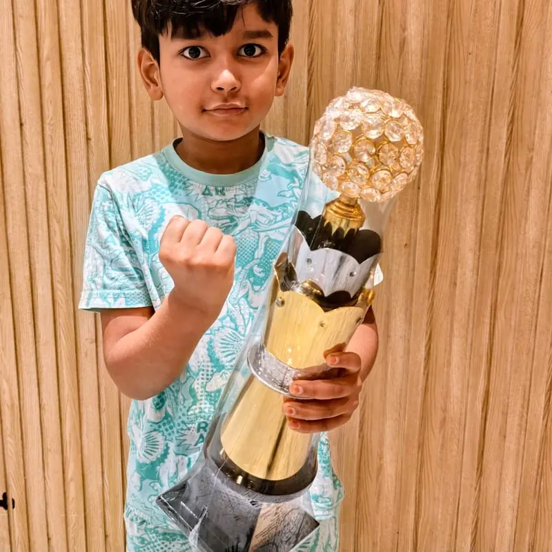 Riyaan Sidharth holding his Karnataka State Under-7 champion's trophy